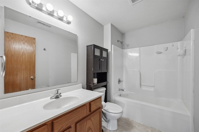 620 Colton Cir NE Unit 11, Cedar Rapids, IA 52402 - full bath with vanity, tile patterned floors, a textured ceiling, and shower / bathtub combination