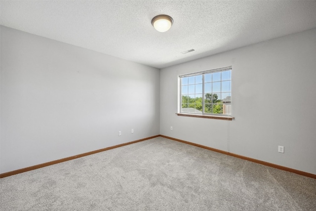 620 Colton Cir NE Unit 11, Cedar Rapids, IA 52402 - empty room with carpet floors and a textured ceiling