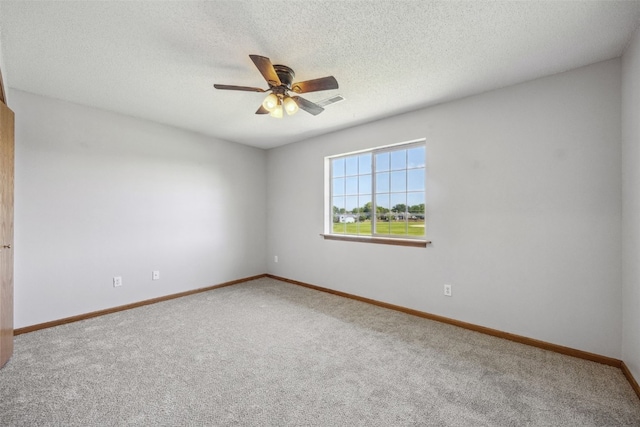 620 Colton Cir NE Unit 11, Cedar Rapids, IA 52402 - carpeted spare room with ceiling fan and a textured ceiling