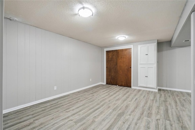 705 Grant Wood Dr SE, Cedar Rapids, IA 52403 - finished below grade area with wood finished floors and a textured ceiling
