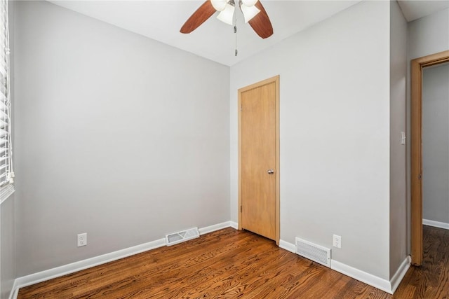 705 Grant Wood Dr SE, Cedar Rapids, IA 52403 - empty room with wood finished floors and ceiling fan