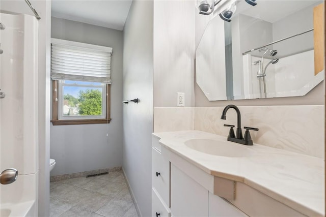 705 Grant Wood Dr SE, Cedar Rapids, IA 52403 - bathroom with vanity, tile patterned floors, decorative backsplash, and shower / tub combination