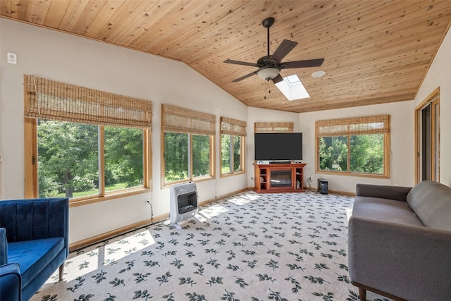 3496 E Otter Rd, Marion, IA 52302 - carpeted living area featuring wood ceiling, ceiling fan, lofted ceiling, a skylight, and heating unit