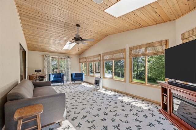 3496 E Otter Rd, Marion, IA 52302 - carpeted living room with a skylight, ceiling fan, lofted ceiling, and wood ceiling
