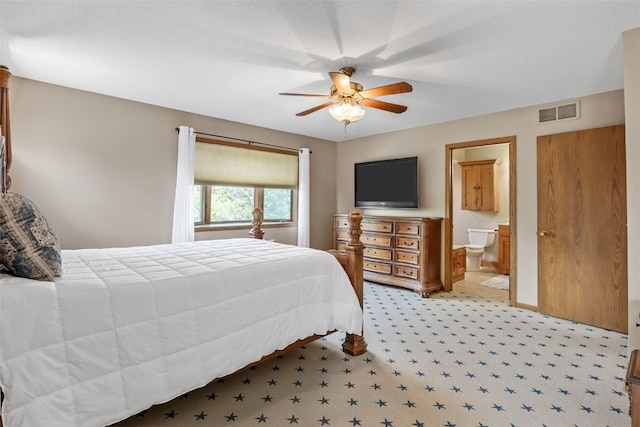 3496 E Otter Rd, Marion, IA 52302 - bedroom with light carpet, ceiling fan, and ensuite bathroom
