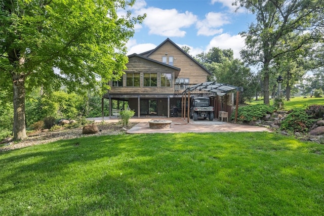 3496 E Otter Rd, Marion, IA 52302 - rear view of property with an outdoor fire pit, a lawn, and a patio