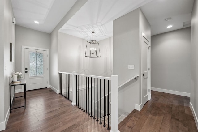 19 Pond Rdg, Coralville, IA 52241 - corridor with an upstairs landing, wood-type flooring, a chandelier, and recessed lighting
