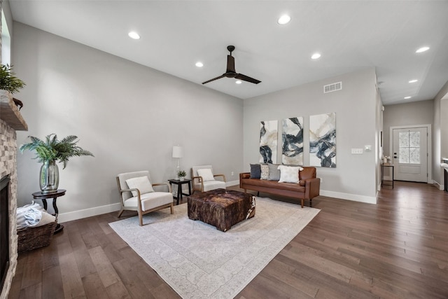 19 Pond Rdg, Coralville, IA 52241 - living area featuring ceiling fan, dark wood-style floors, a stone fireplace, and recessed lighting