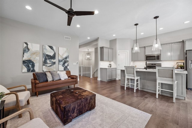 19 Pond Rdg, Coralville, IA 52241 - living room with wood finished floors, a ceiling fan, and recessed lighting