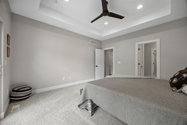 19 Pond Rdg, Coralville, IA 52241 - carpeted bedroom with a tray ceiling, recessed lighting, and ceiling fan