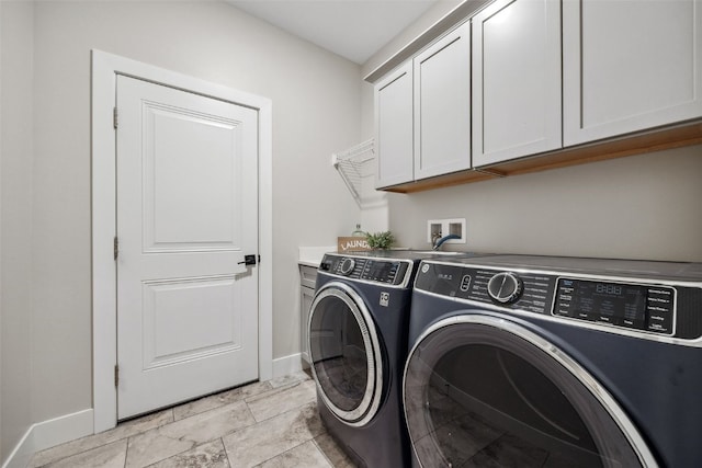 19 Pond Rdg, Coralville, IA 52241 - laundry area featuring washer and dryer, cabinet space, and light marble finish floors