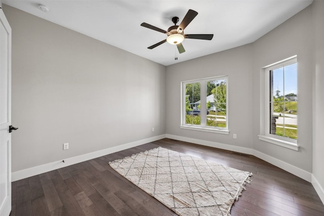 19 Pond Rdg, Coralville, IA 52241 - empty room featuring dark wood-style flooring, a ceiling fan, and a smoke detector