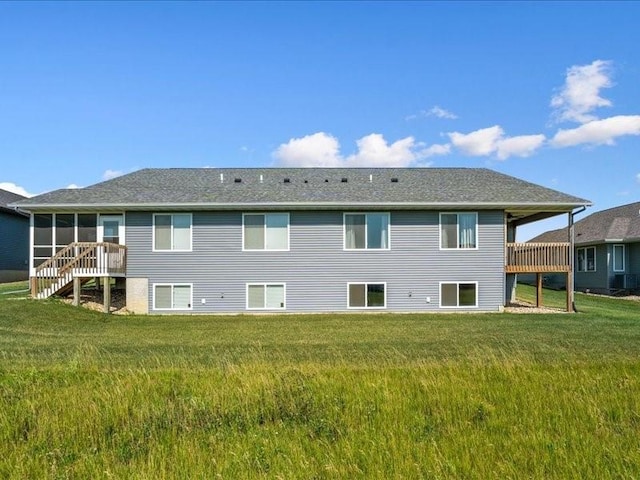 3602 Bluebird Dr SW, Cedar Rapids, IA 52404 - back of house with a yard and a sunroom