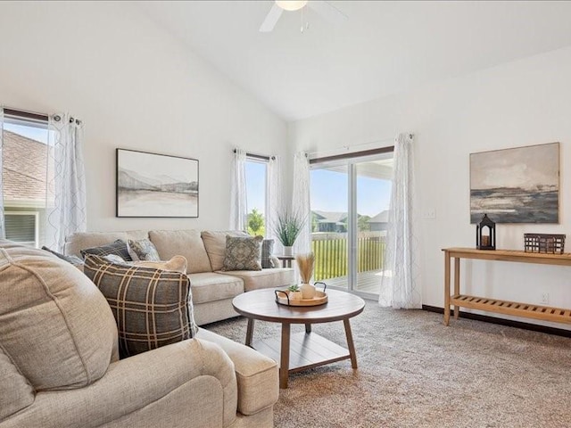 3602 Bluebird Dr SW, Cedar Rapids, IA 52404 - carpeted living area with plenty of natural light, a ceiling fan, and high vaulted ceiling