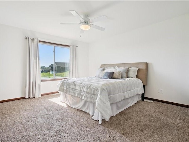 3602 Bluebird Dr SW, Cedar Rapids, IA 52404 - carpeted bedroom featuring baseboards and ceiling fan
