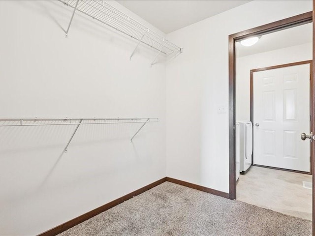 3602 Bluebird Dr SW, Cedar Rapids, IA 52404 - walk in closet featuring light carpet