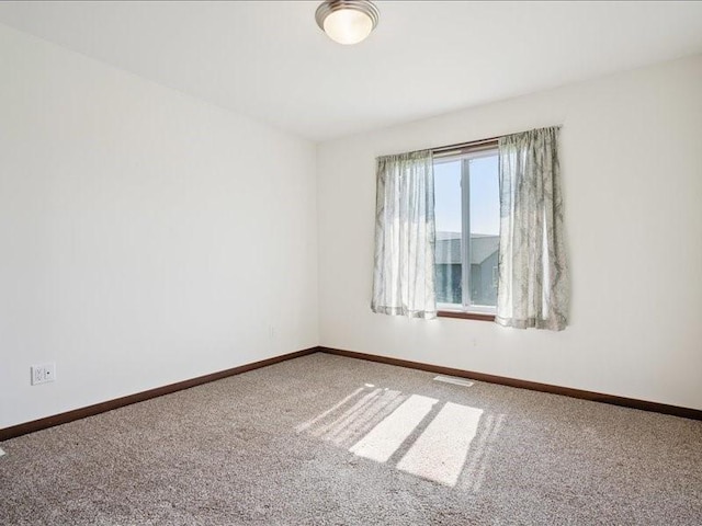 3602 Bluebird Dr SW, Cedar Rapids, IA 52404 - carpeted spare room featuring baseboards