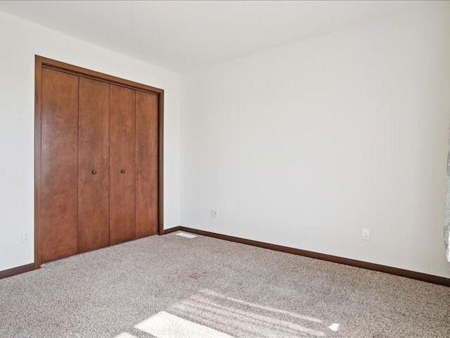 3602 Bluebird Dr SW, Cedar Rapids, IA 52404 - unfurnished bedroom with carpet and a closet
