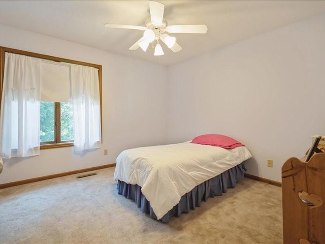 2066 Vista Cir NW, Cedar Rapids, IA 52405 - bedroom featuring light carpet and a ceiling fan