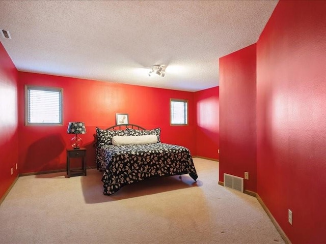 2066 Vista Cir NW, Cedar Rapids, IA 52405 - carpeted bedroom featuring a textured ceiling