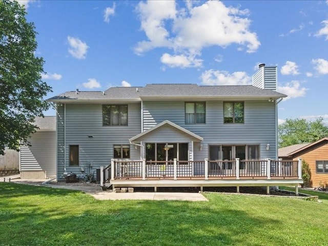 2066 Vista Cir NW, Cedar Rapids, IA 52405 - rear view of property with a wooden deck, a chimney, and a yard