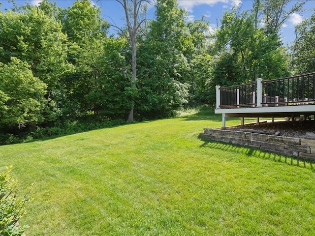 2066 Vista Cir NW, Cedar Rapids, IA 52405 - view of grassy yard with a wooden deck