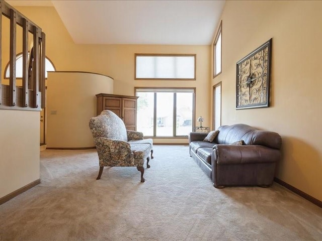 2066 Vista Cir NW, Cedar Rapids, IA 52405 - living room featuring light colored carpet and a towering ceiling
