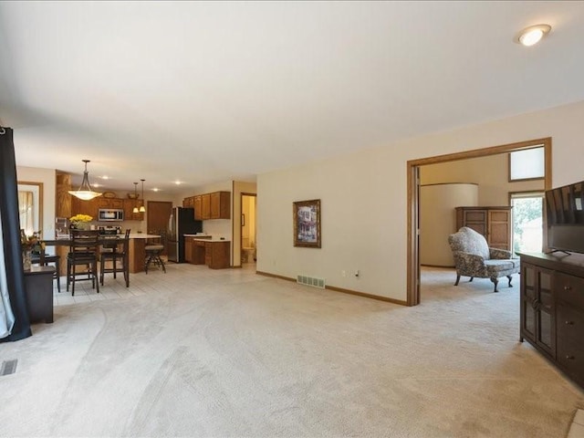 2066 Vista Cir NW, Cedar Rapids, IA 52405 - living area with light colored carpet and baseboards