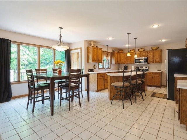 2066 Vista Cir NW, Cedar Rapids, IA 52405 - dining room with light tile patterned floors and recessed lighting