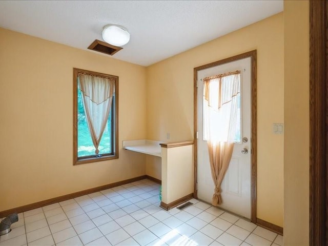 2066 Vista Cir NW, Cedar Rapids, IA 52405 - spare room with baseboards and light tile patterned floors