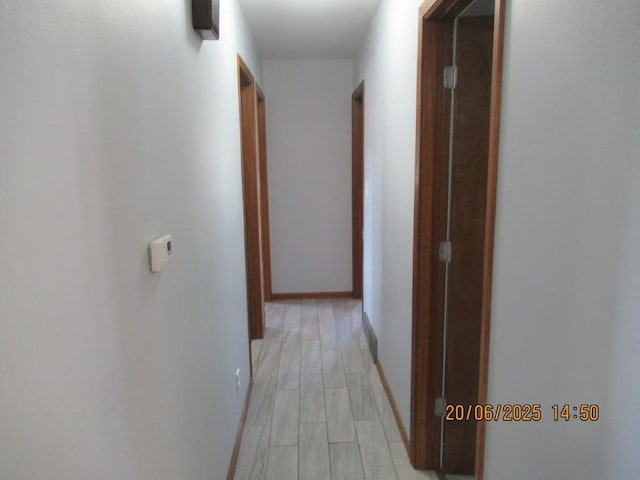302 Meridian St, Tipton, IA 52772 - hallway featuring baseboards