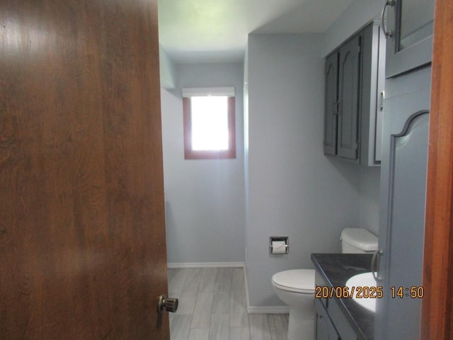 302 Meridian St, Tipton, IA 52772 - bathroom with vanity and toilet