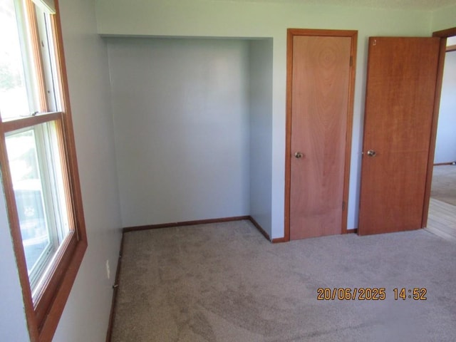 302 Meridian St, Tipton, IA 52772 - unfurnished bedroom with carpet floors