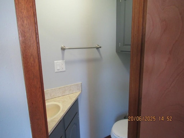 302 Meridian St, Tipton, IA 52772 - bathroom with vanity and toilet