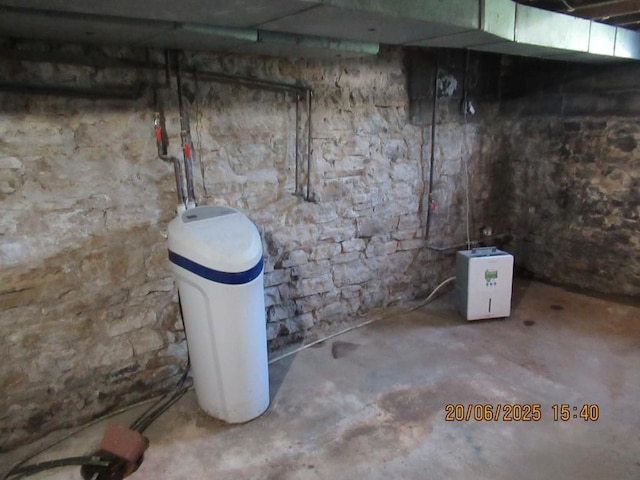 302 Meridian St, Tipton, IA 52772 - unfinished basement featuring a water softener system