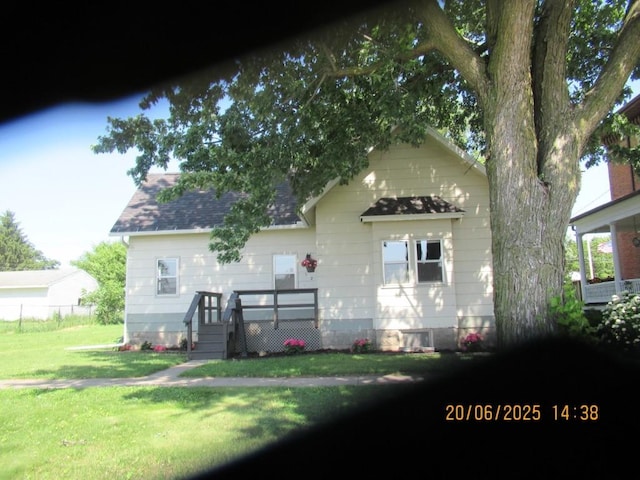 302 Meridian St, Tipton, IA 52772 - back of house featuring roof with shingles
