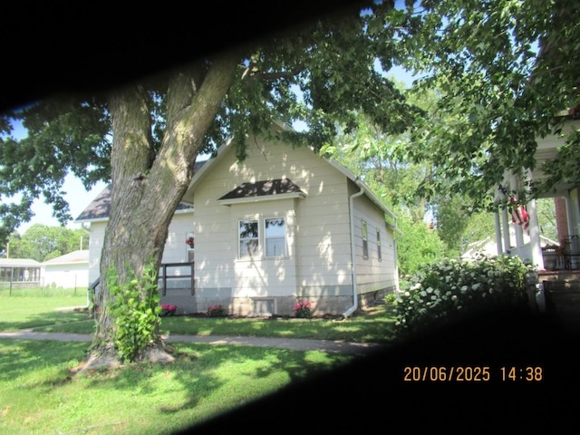 302 Meridian St, Tipton, IA 52772 - view of home's exterior featuring a yard