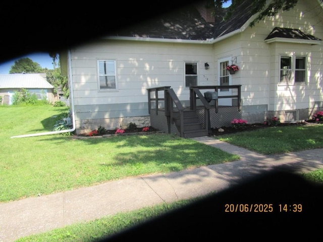 302 Meridian St, Tipton, IA 52772 - view of front of house featuring a front lawn and roof with shingles