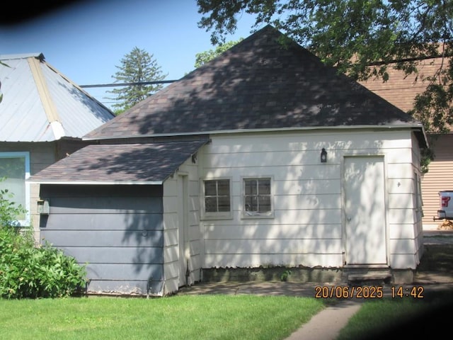 302 Meridian St, Tipton, IA 52772 - view of side of property featuring a shingled roof