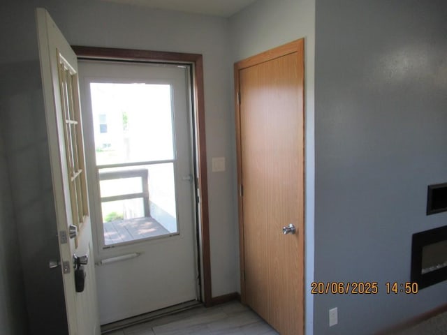 302 Meridian St, Tipton, IA 52772 - doorway with healthy amount of natural light