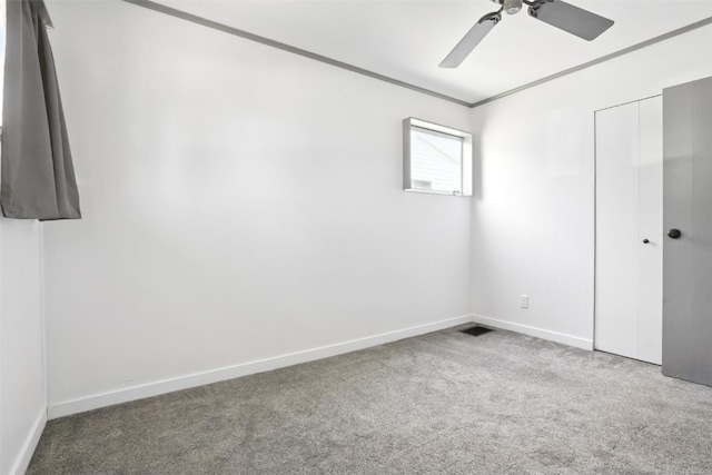 1635 Keith Dr NE, Cedar Rapids, IA 52402 - unfurnished bedroom with carpet floors, a closet, crown molding, and ceiling fan