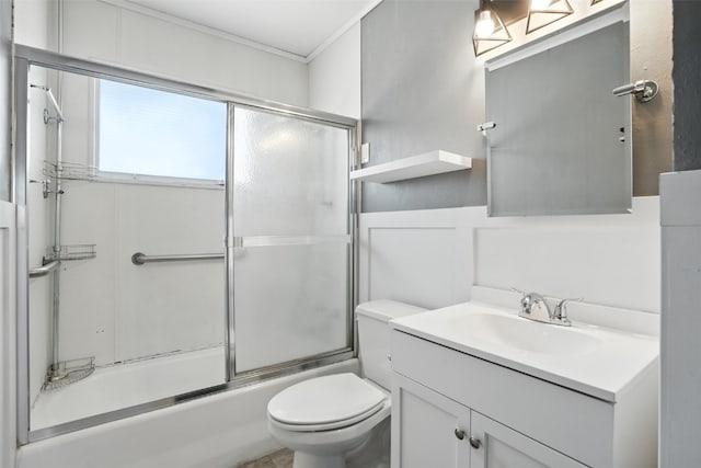 1635 Keith Dr NE, Cedar Rapids, IA 52402 - bathroom featuring vanity, bath / shower combo with glass door, and crown molding