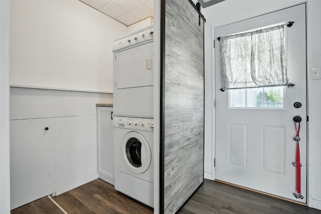1635 Keith Dr NE, Cedar Rapids, IA 52402 - laundry room with stacked washer / drying machine and dark wood-type flooring