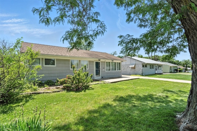 1635 Keith Dr NE, Cedar Rapids, IA 52402 - ranch-style home featuring a front lawn and a patio