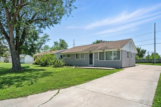 1635 Keith Dr NE, Cedar Rapids, IA 52402 - ranch-style house with concrete driveway and a chimney