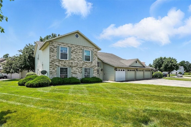 4121 Lexington Dr NE Unit B, Cedar Rapids, IA 52402 - view of front facade featuring a garage, driveway, and a front yard