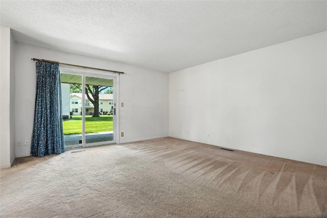 4121 Lexington Dr NE Unit B, Cedar Rapids, IA 52402 - empty room with carpet and a textured ceiling