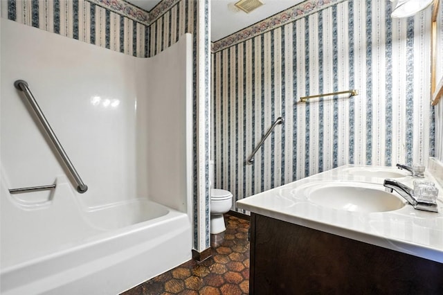 4121 Lexington Dr NE Unit B, Cedar Rapids, IA 52402 - full bath featuring double vanity, bathtub / shower combination, and wallpapered walls