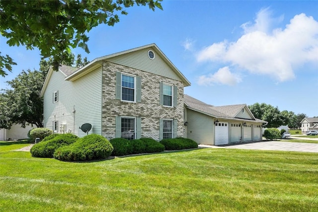 4121 Lexington Dr NE Unit B, Cedar Rapids, IA 52402 - traditional-style home with an attached garage, a front lawn, driveway, and brick siding