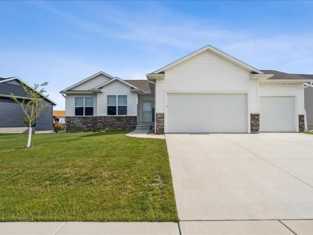 1326 Echo Ridge Ln, Marion, IA 52302 - view of front of property featuring stone siding, an attached garage, concrete driveway, and a front lawn